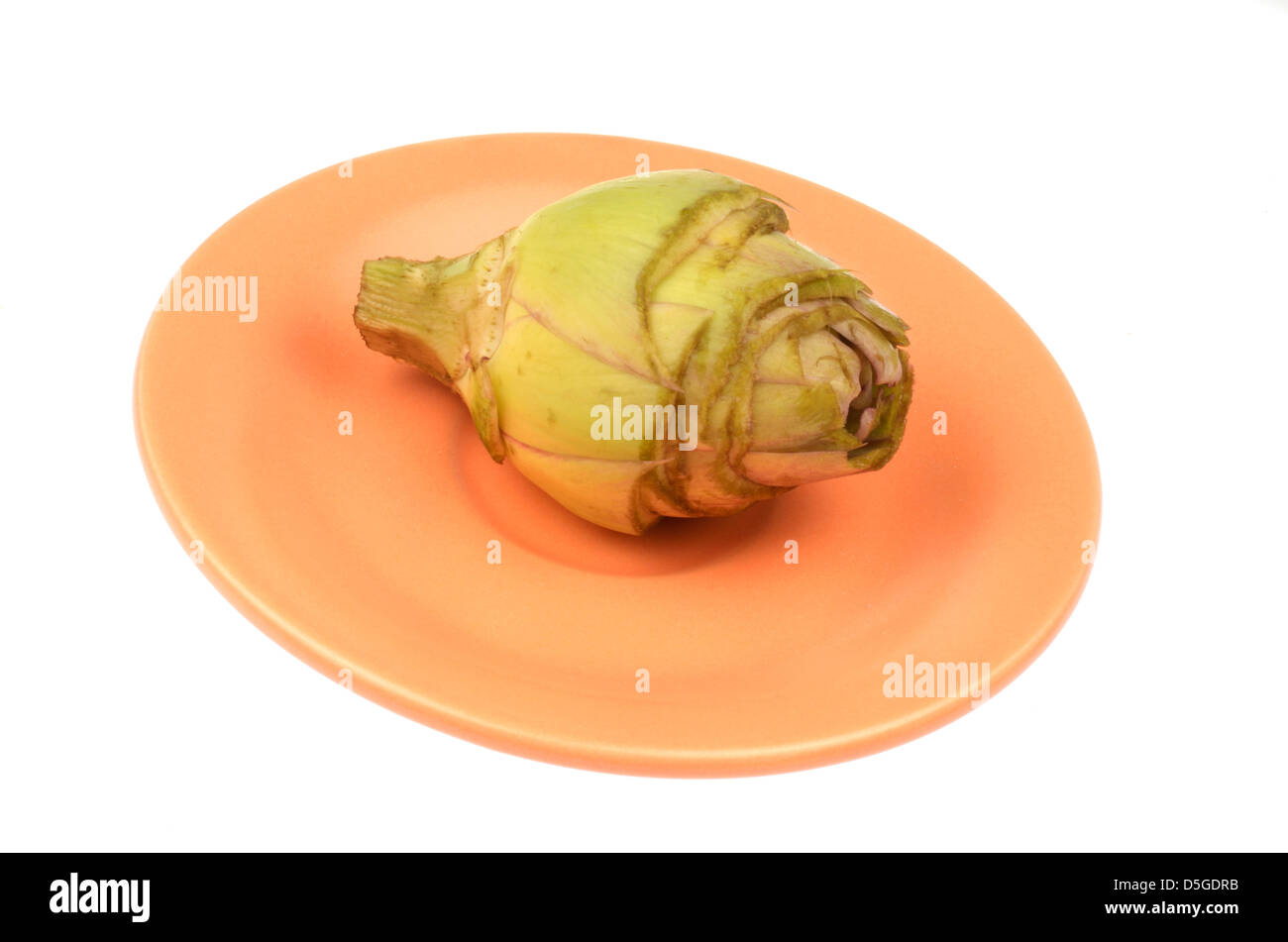 artichoke peeled and cleaned on saucer Stock Photo