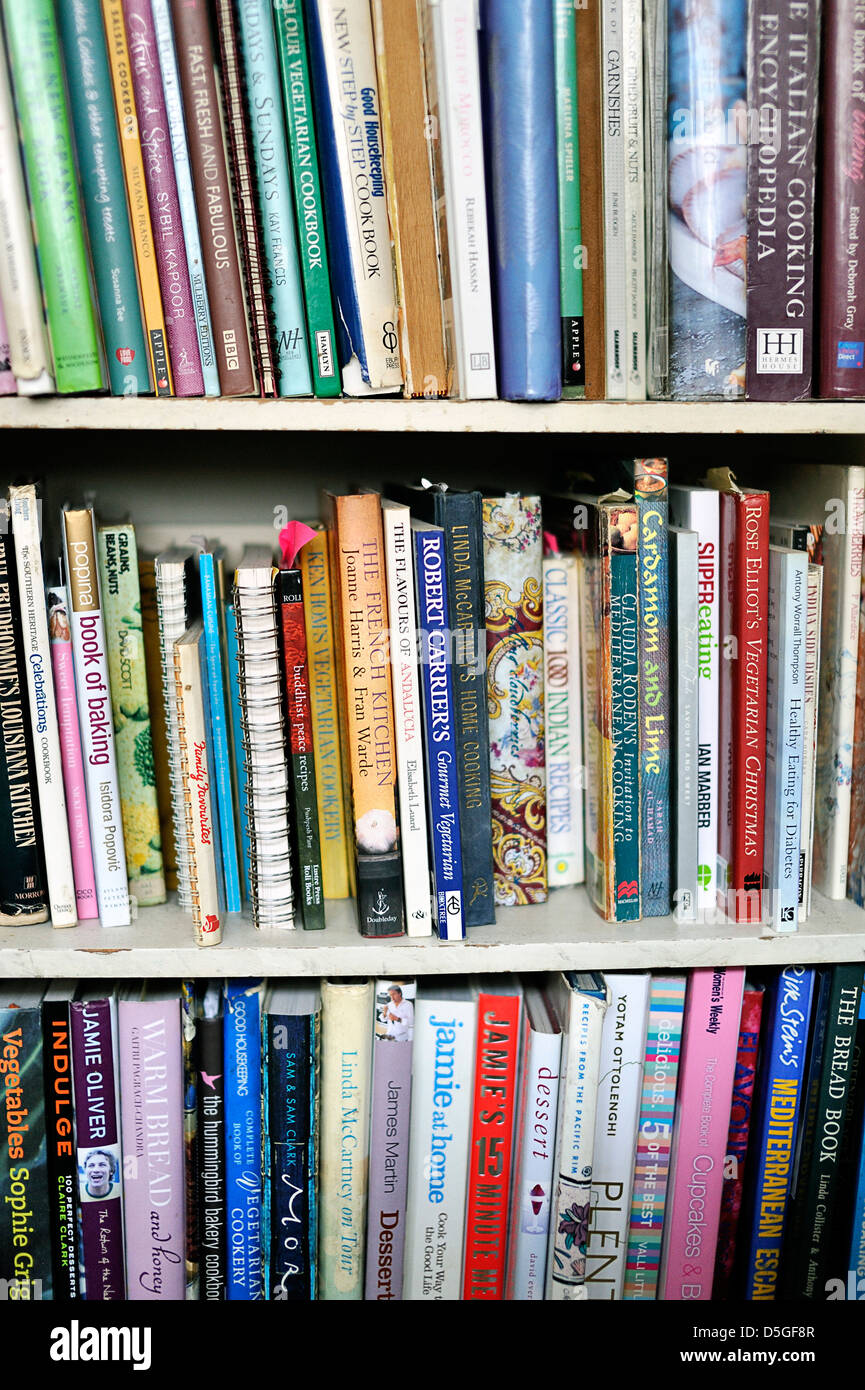 Shelves full of cookery books Stock Photo Alamy