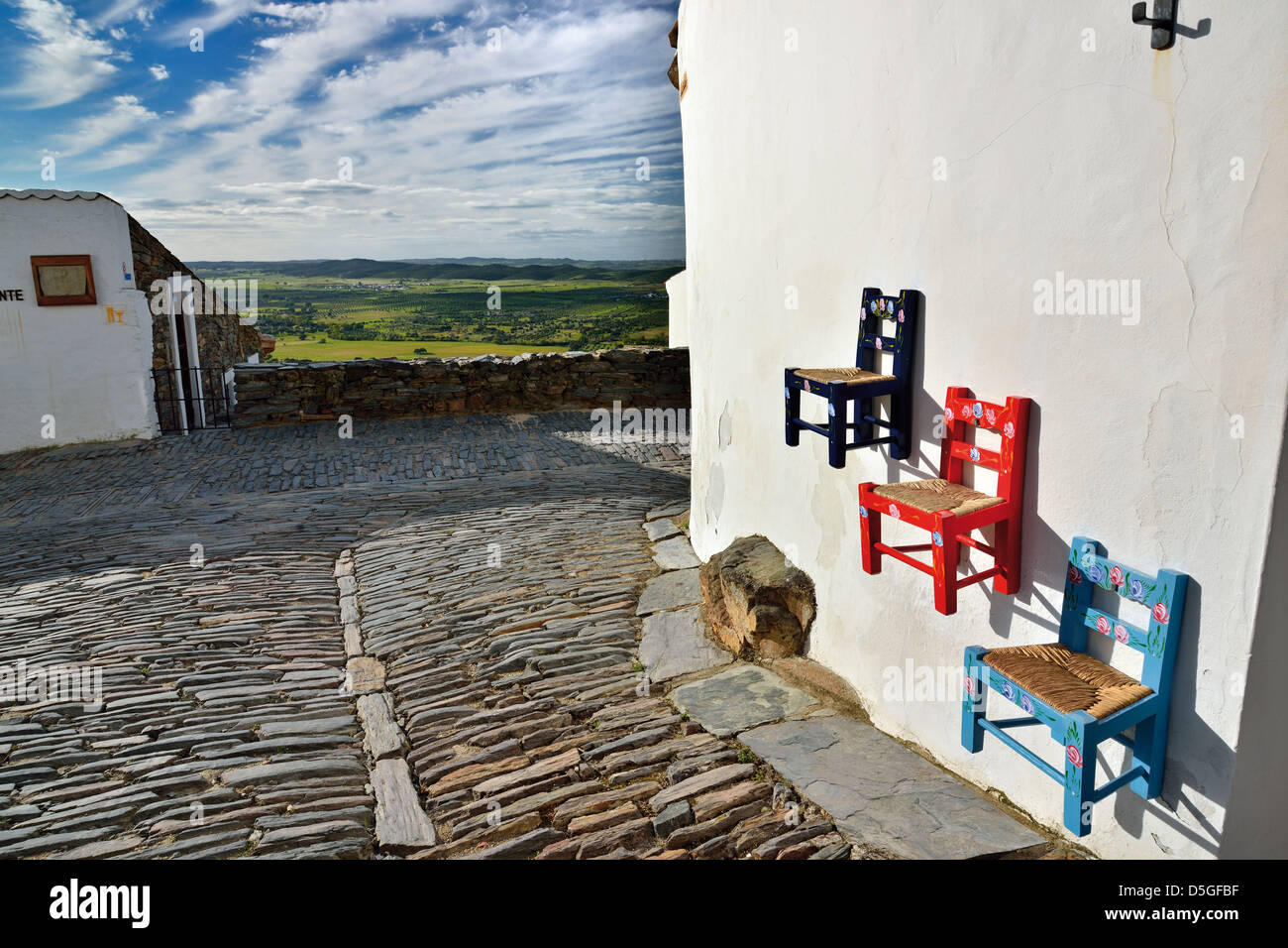 Portugal, Alentejo: Hand made chairs at the walls of Souvenir Shop Mufla in historical village of Monsaraz Stock Photo