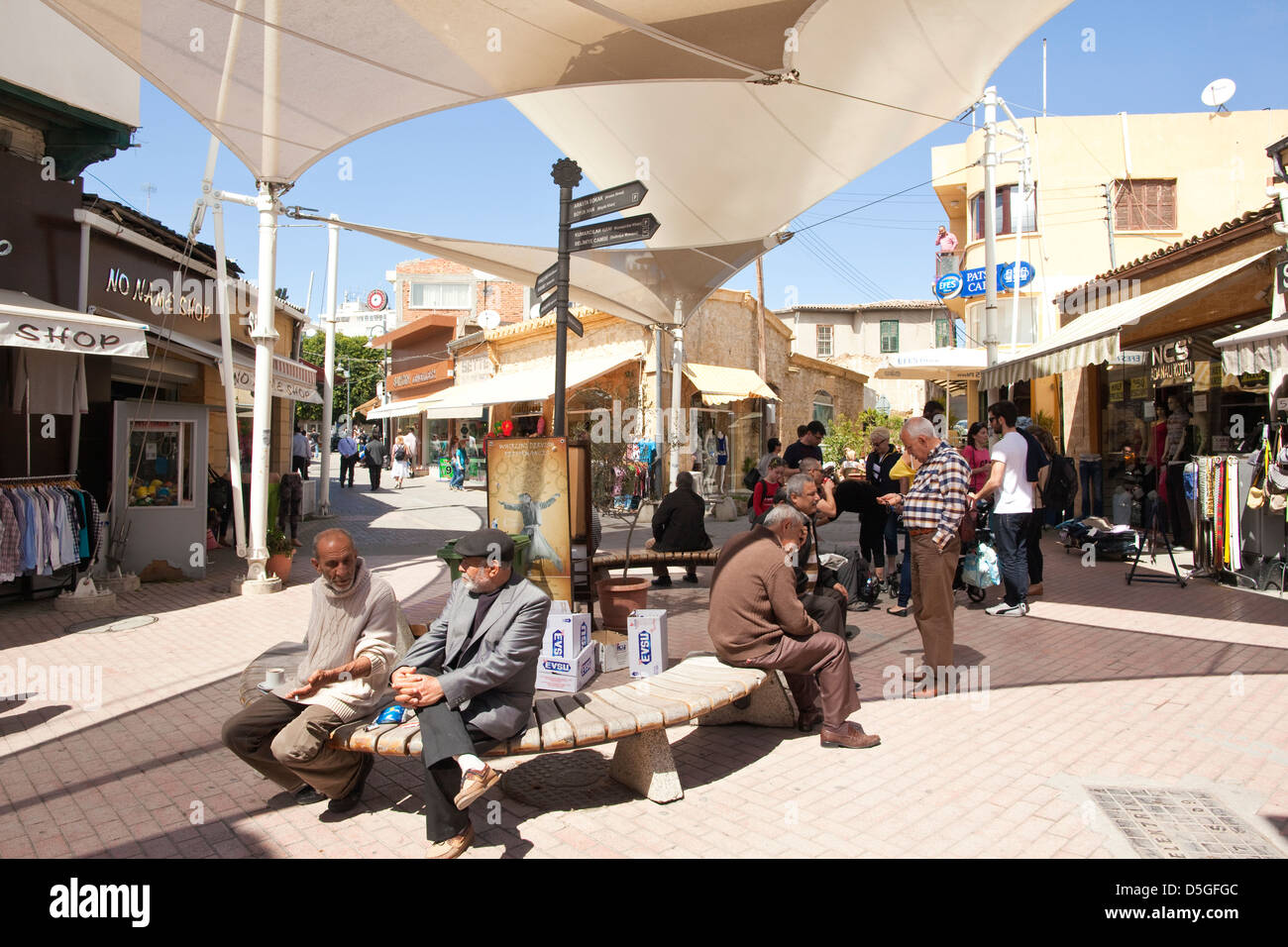 Turkish Cypriot men sitting outside in one of the street bazaars, Nicosia North, Turkish Republic of Northern Cyprus Stock Photo