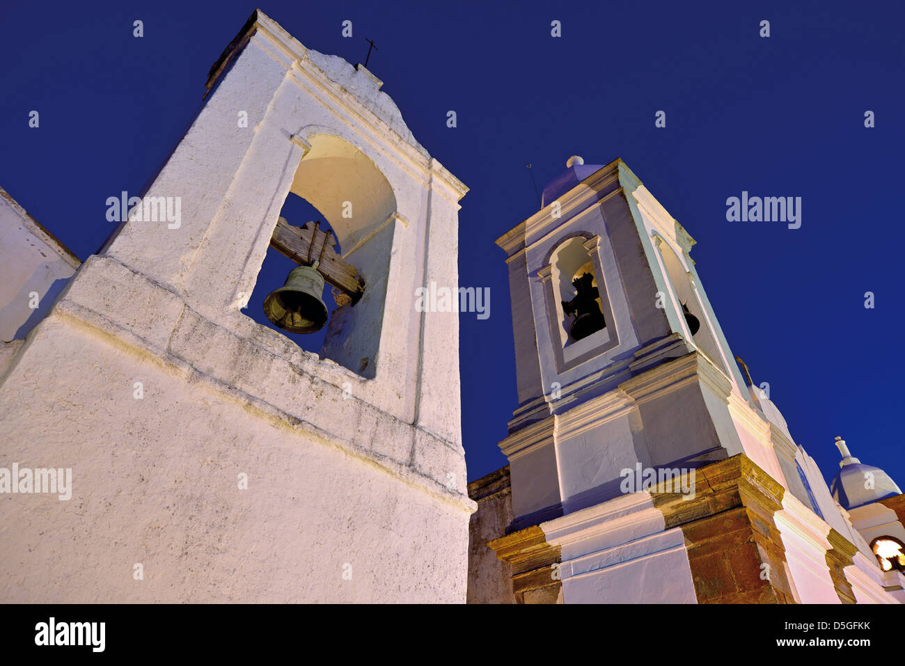 Portugal, Alentejo: Bell towers of the Fresco Museum and parish church Nossa Senhora da Lagoa at night Stock Photo