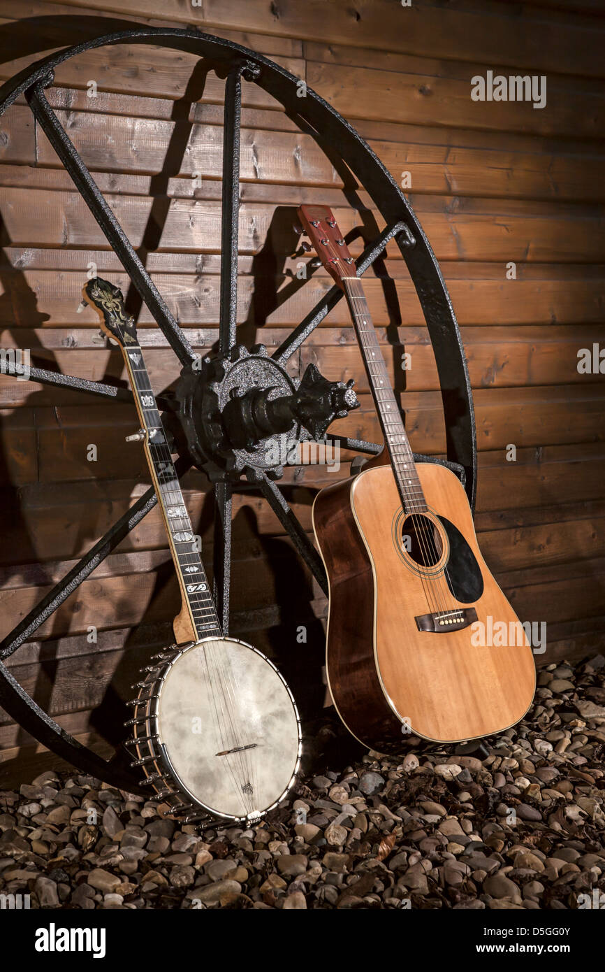 Five stringed banjo and a steel stringed acoustic guitar. Stock Photo