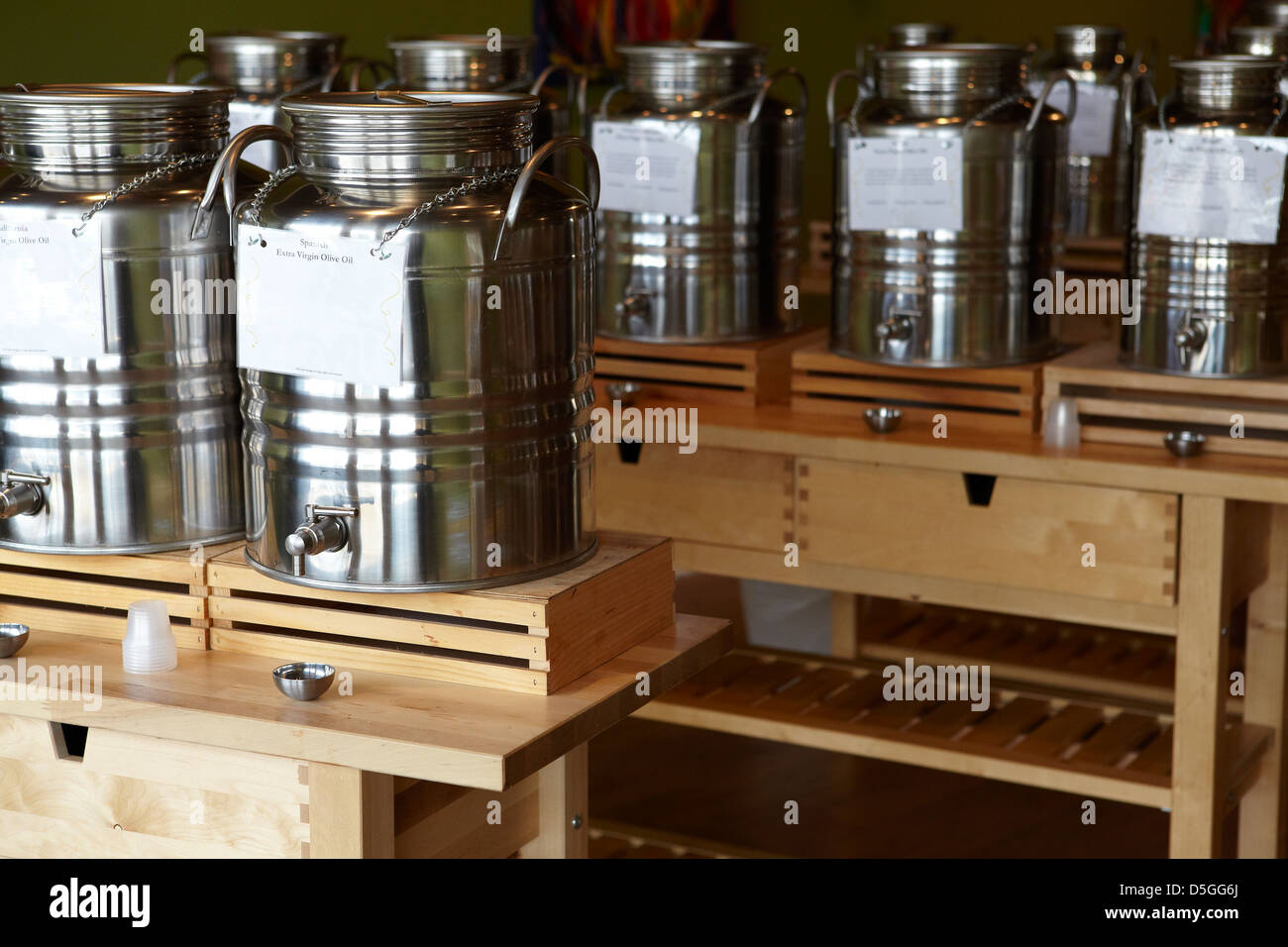https://c8.alamy.com/comp/D5GG6J/containers-of-olive-oil-and-vinegar-at-store-samples-are-available-D5GG6J.jpg
