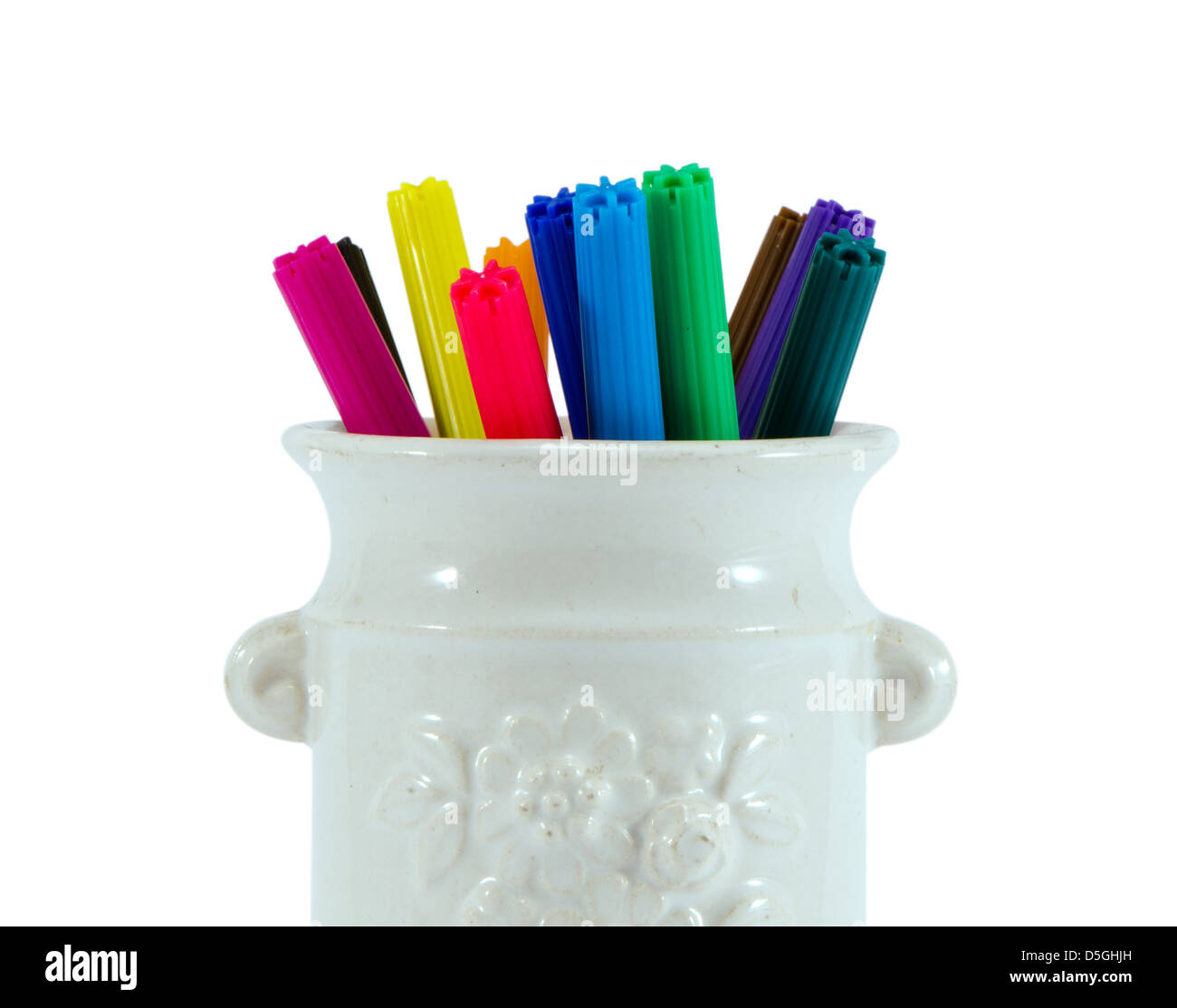 closeup of colorful felt tip pens in retro clay cup isolated on white background Stock Photo
