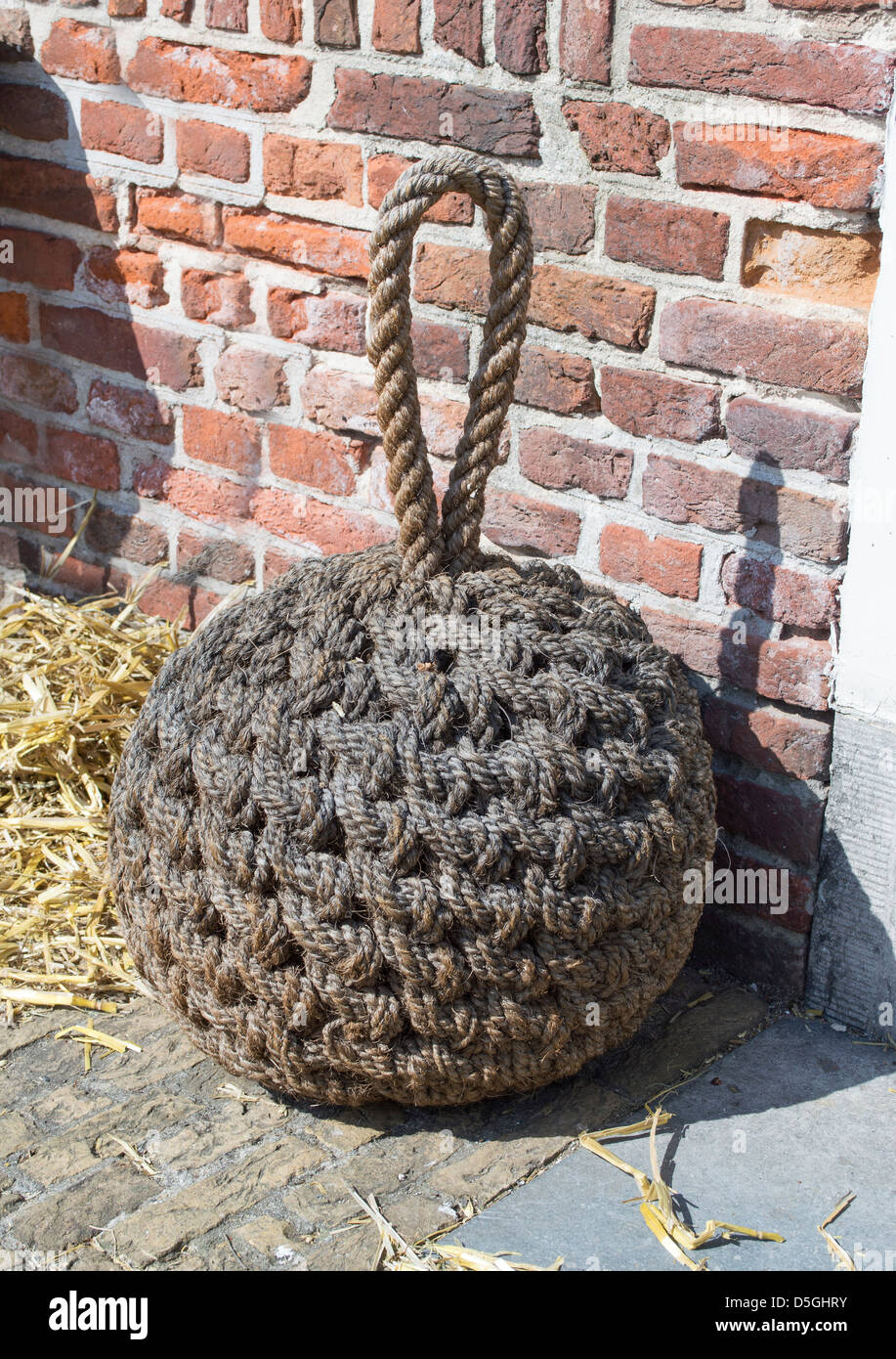 traditional door stop made from ropes Stock Photo - Alamy