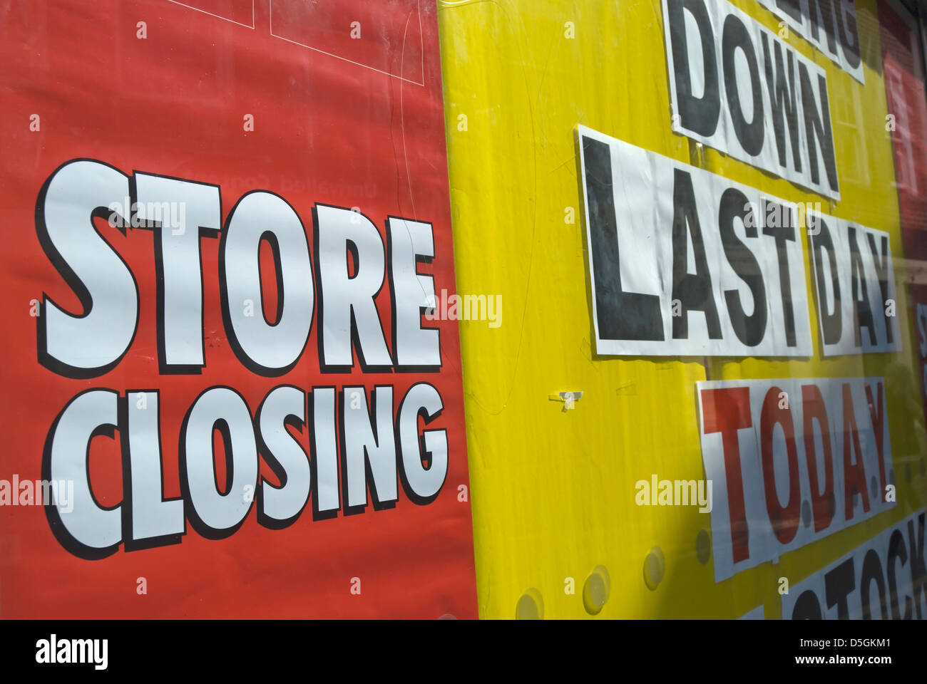 shop window poster stating last day, store closing, kingston, surrey