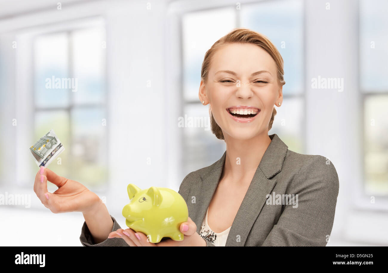 lovely woman with piggy bank and money Stock Photo - Alamy
