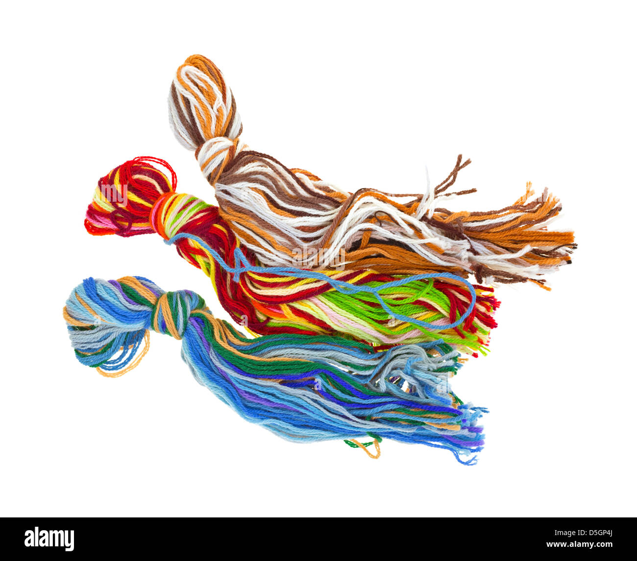 Three knotted groups of different shades of yarn on a white background