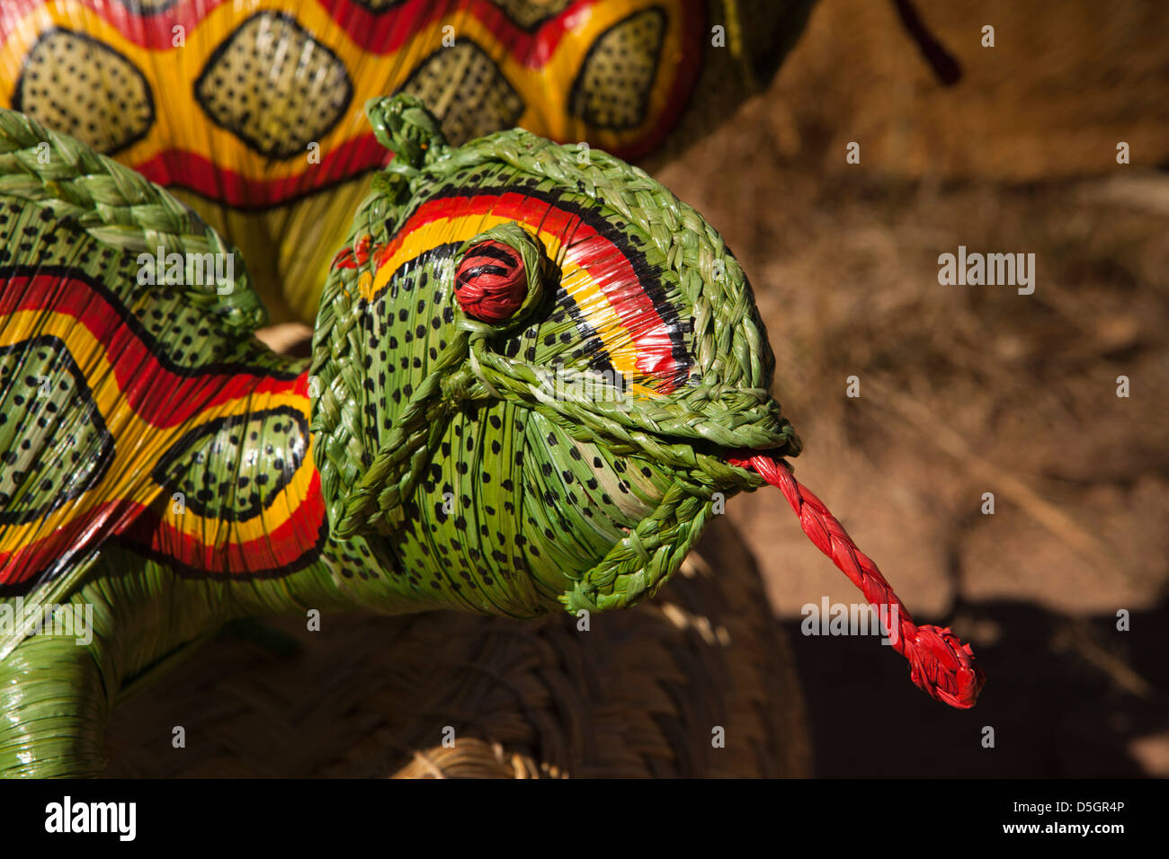 Madagascar, Ambatolampy, roadside stall selling raffia animals, head of chameleon Stock Photo