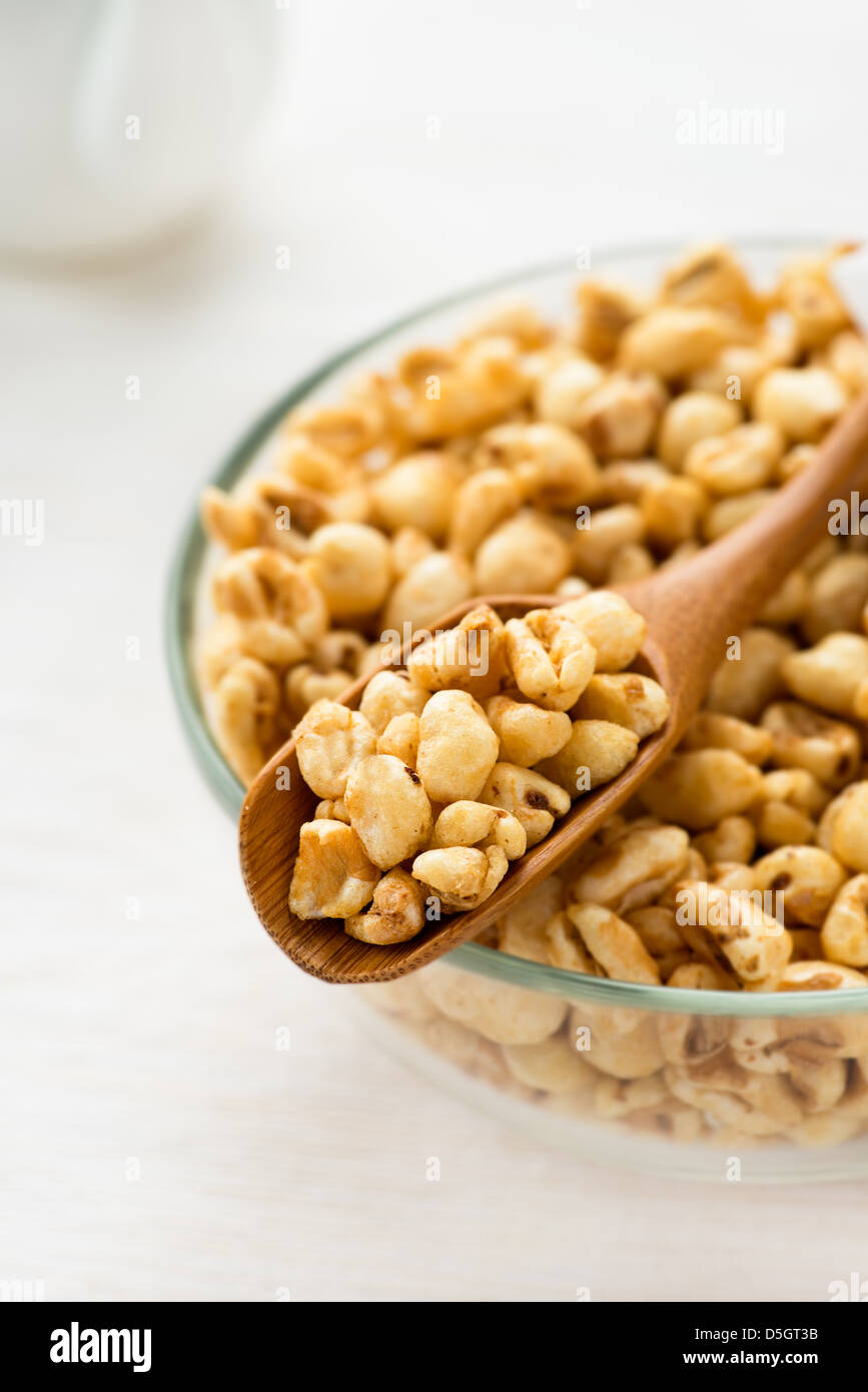 Puffed wheat cereal for breakfast, selective focus Stock Photo