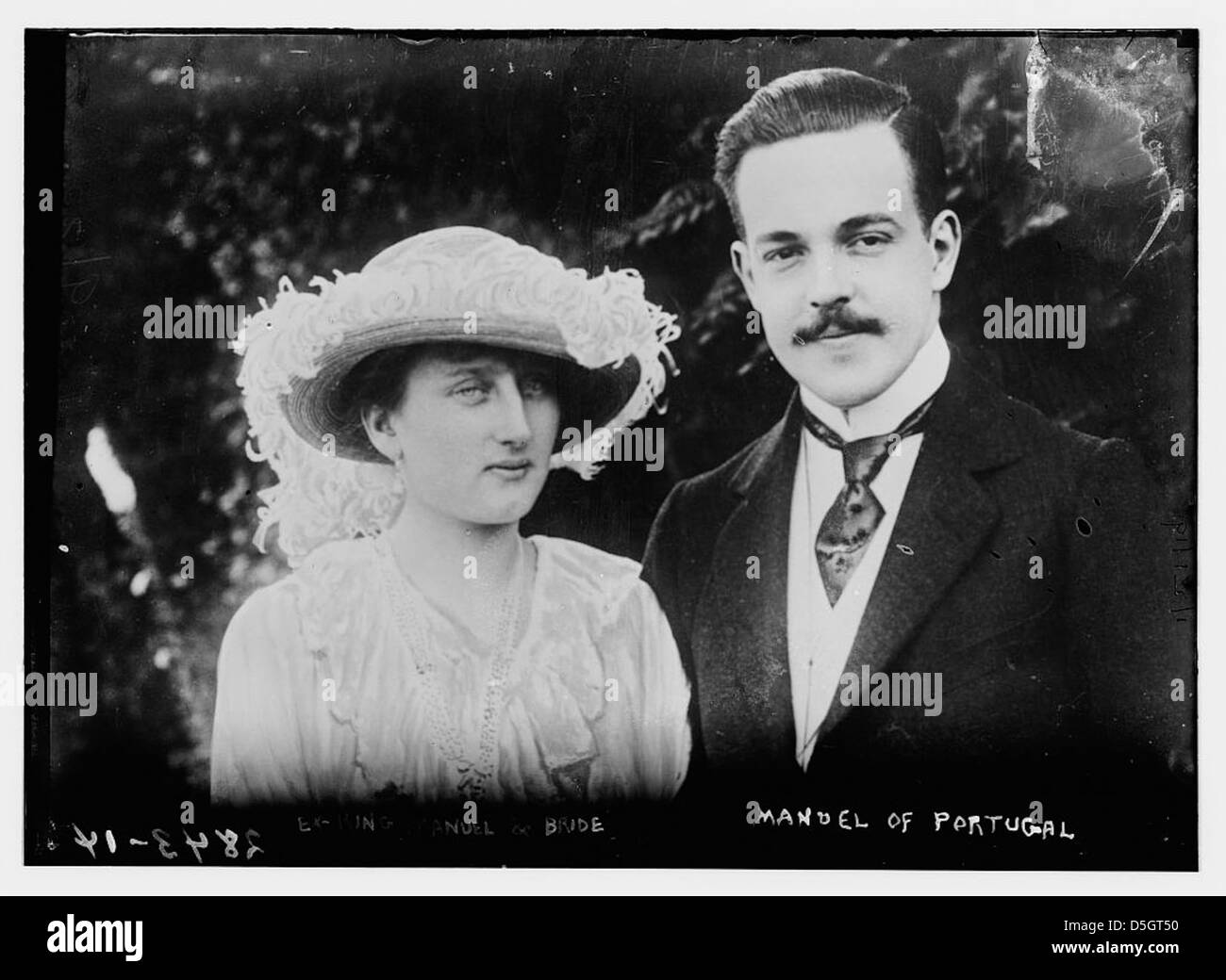 Ex-King Manuel II of Portugal and his bride, Augusta Victoria of Hohenzollern, are photographed together in this formal portrait. Manuel II was the last monarch of Portugal before the republic was established. Stock Photo