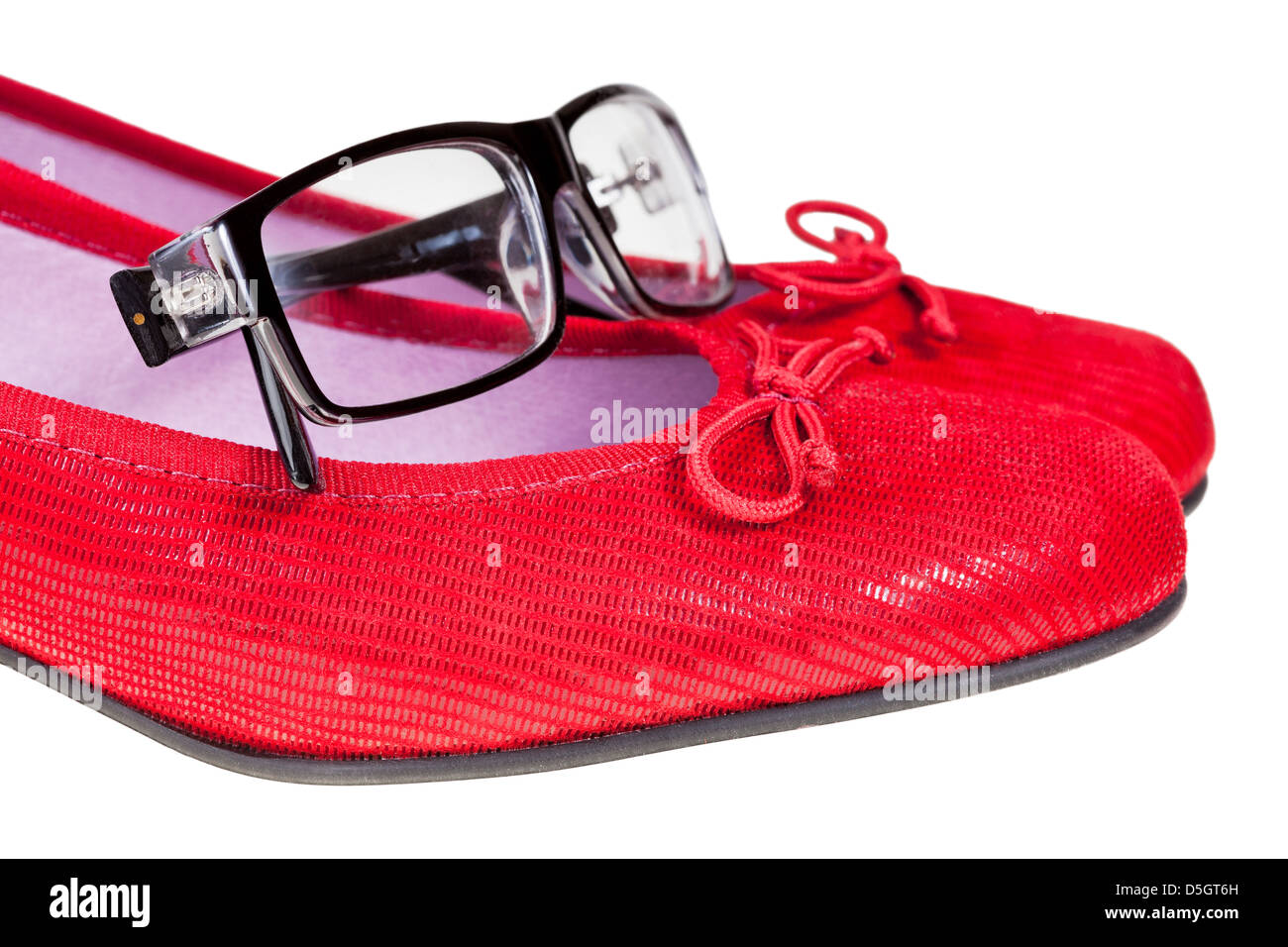 red women's shoes and black no name eyeglasses isolated on white background Stock Photo