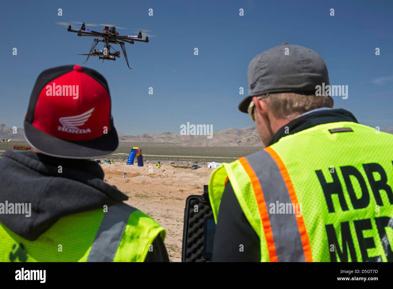 Jean, Nevada - Photographers use an unmanned aerial vehicle to photograph the Mint 400, an off-road race in the Mojave Desert. Stock Photo