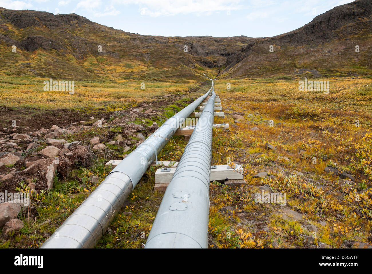Pipeline crossing moorland, Qeqertarsuaq, Greenland Stock Photo