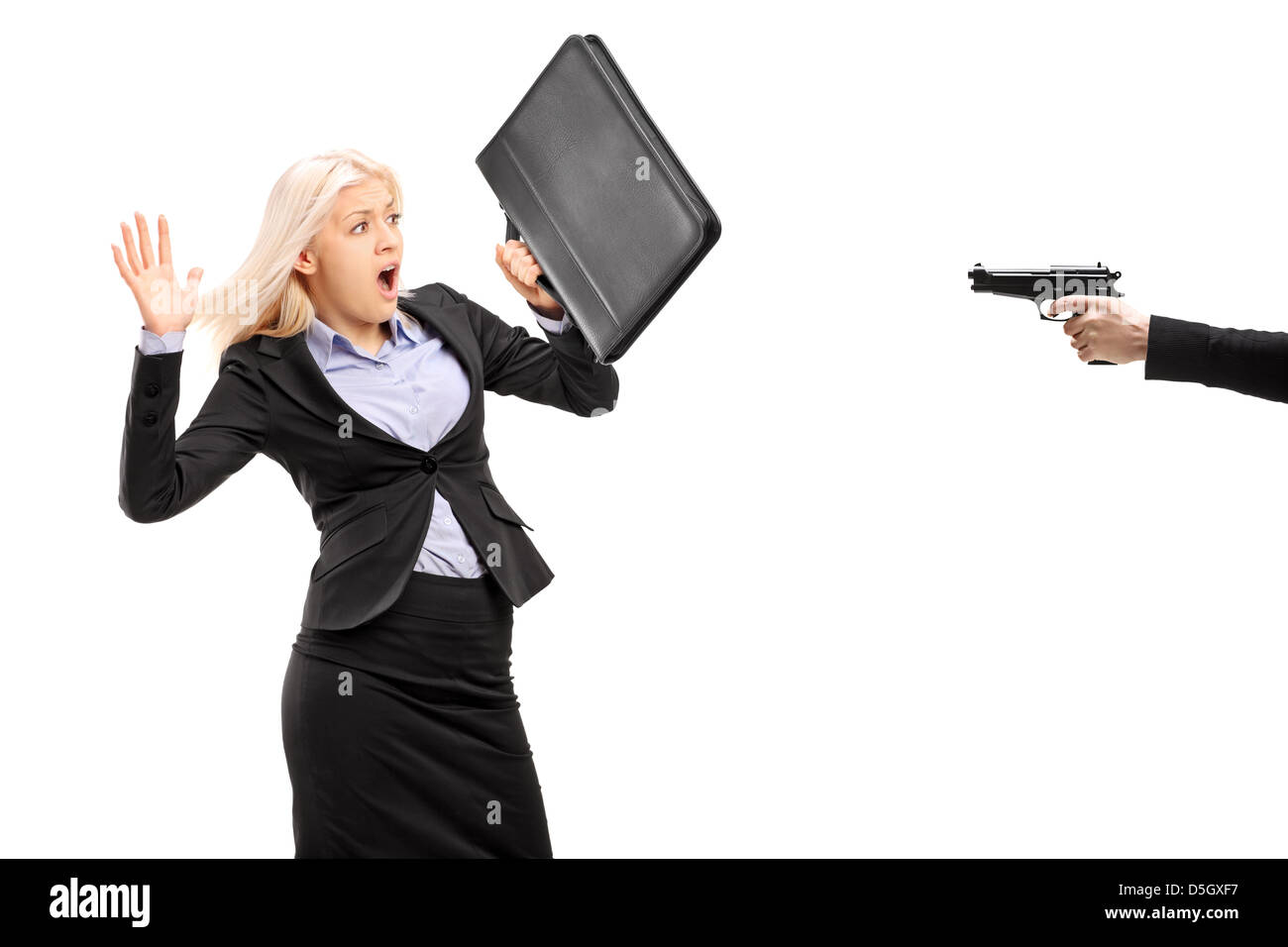 Afraid businesswoman from a gun isolated on white background Stock Photo