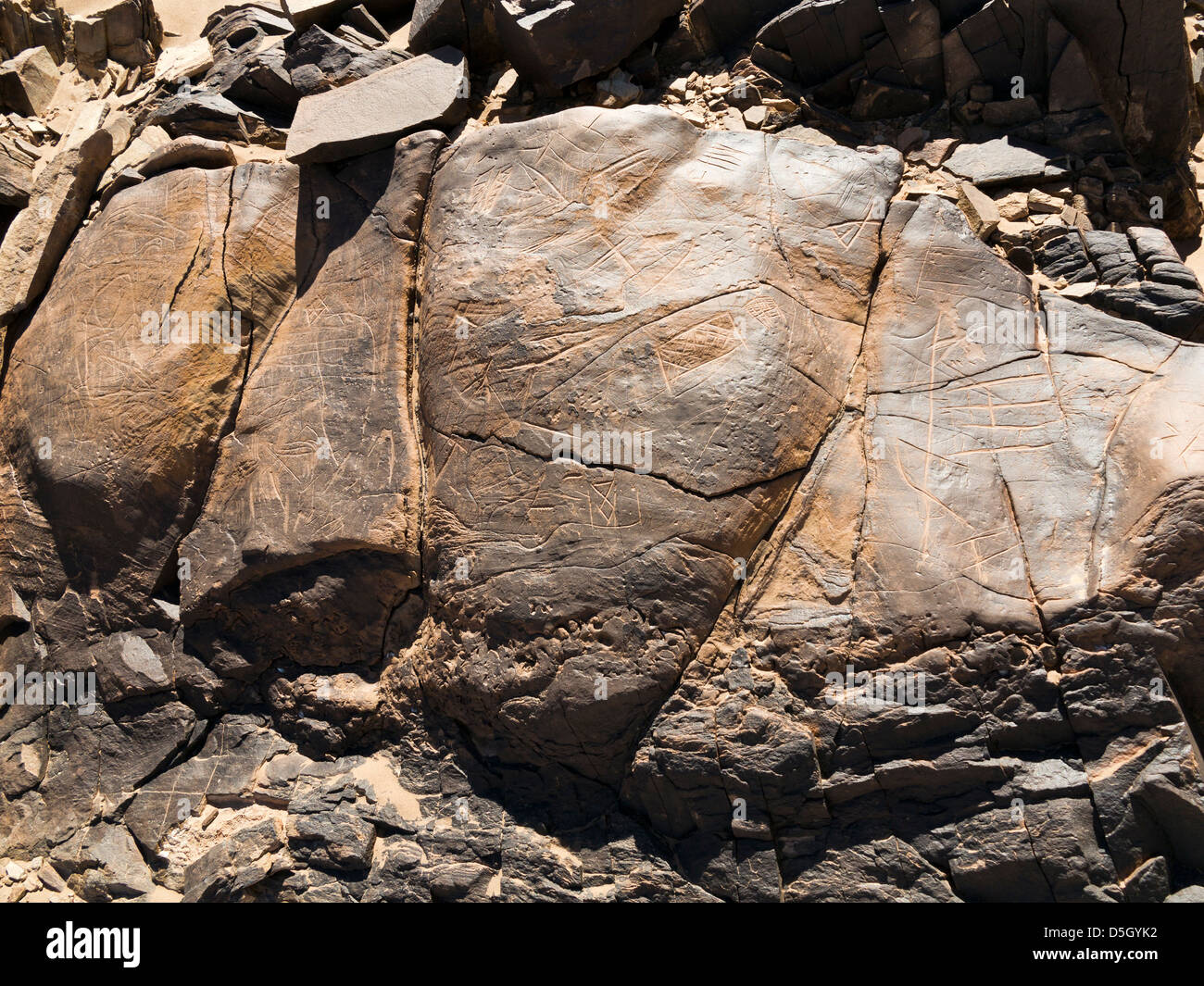 Prehistoric rock carvings at Oued Mestakou on the Tata to Akka road in Morocco. Stock Photo