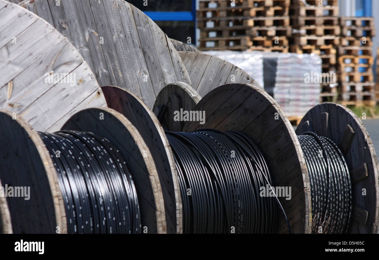 long black telephone cables on wooden spool Stock Photo Alamy