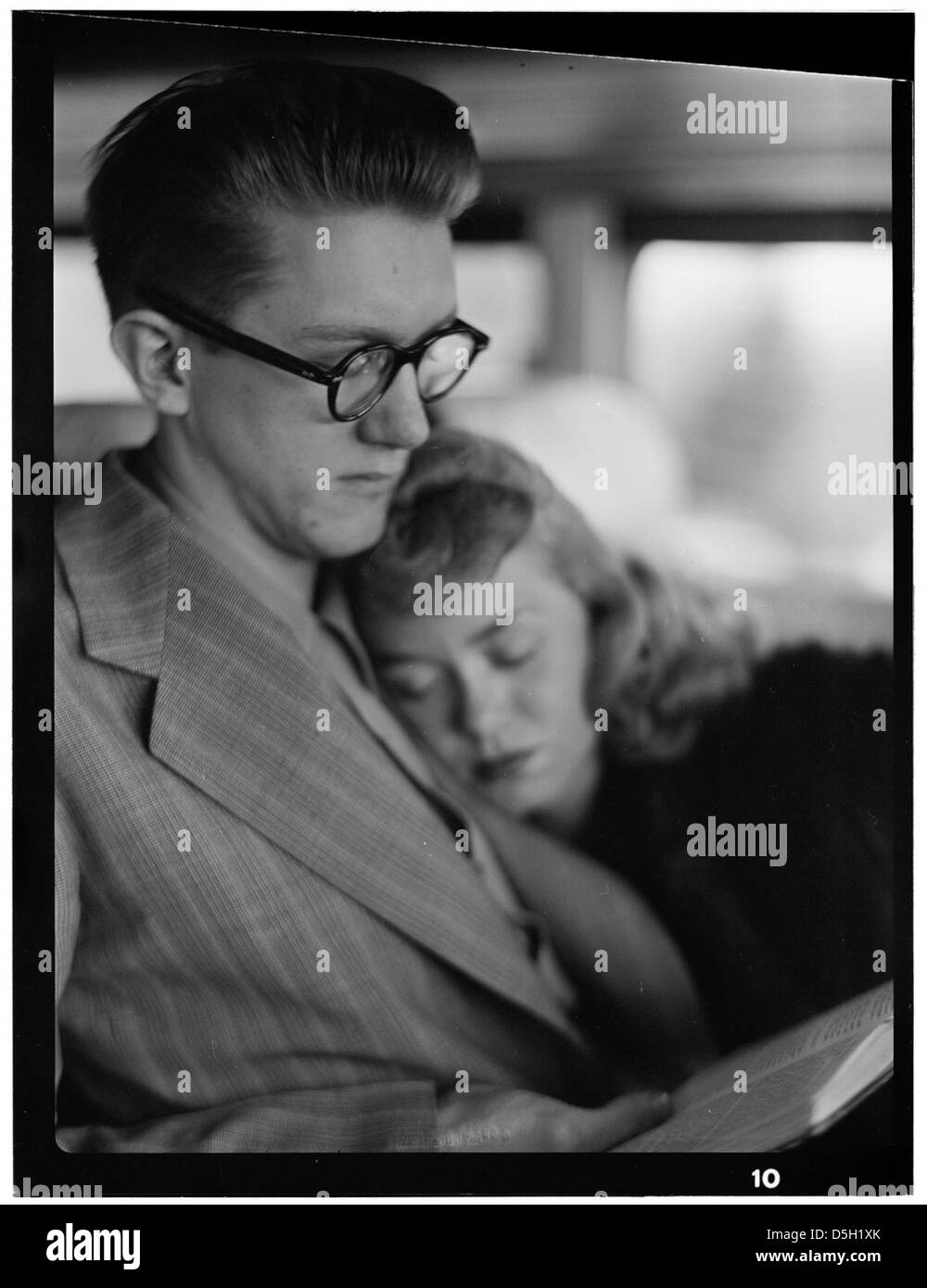 This portrait captures June Christy and Bob Cooper, two notable figures from the 1940s. The image showcases their distinct styles, with Christy wearing glasses and the couple posing in a moment of calm during the forties. Stock Photo
