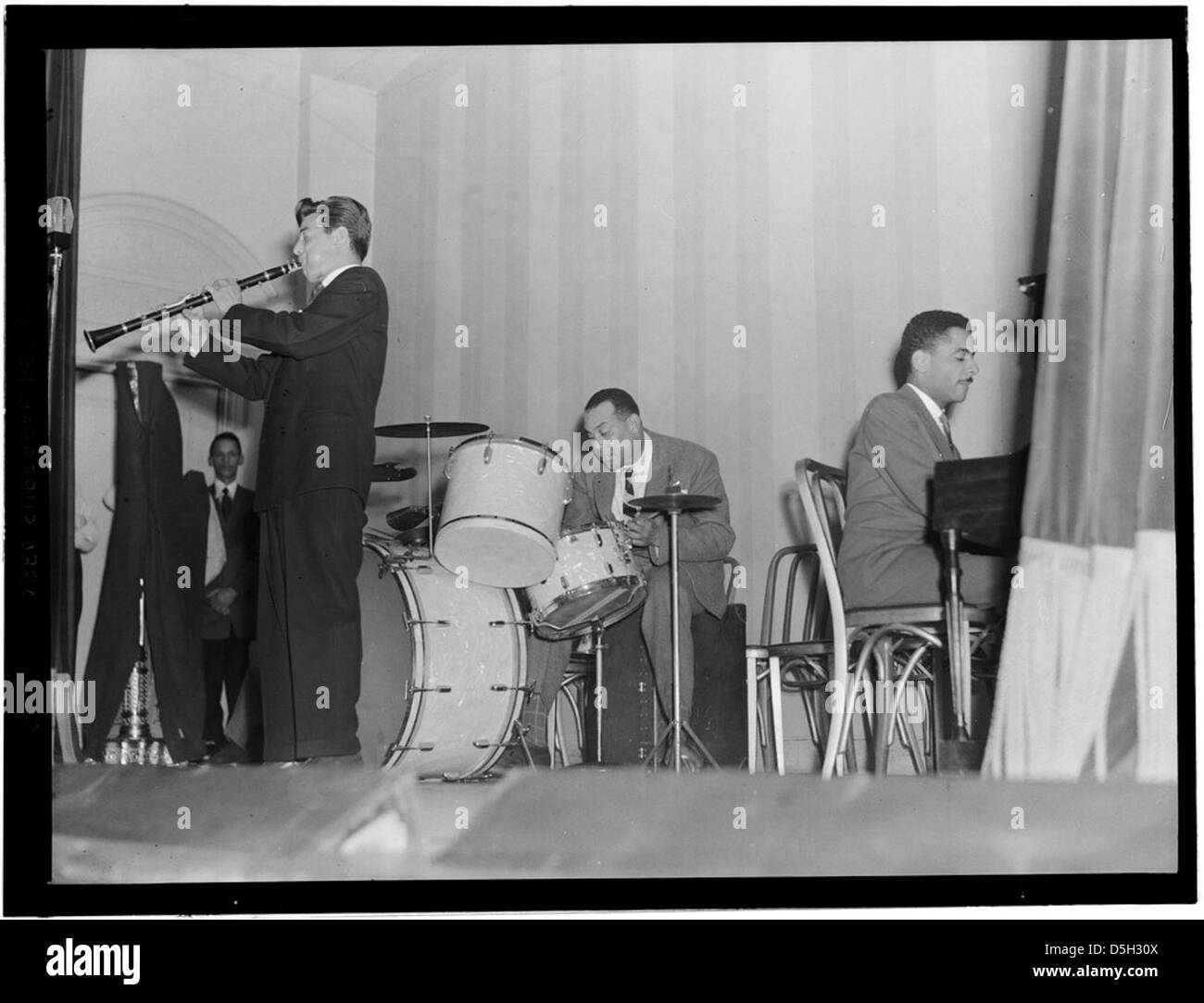 Joe Marsala, Zutty Singleton, and Teddy Wilson are pictured at the National Press Club in Washington, D.C. in the late 1930s, showcasing their involvement in the American jazz scene. Stock Photo