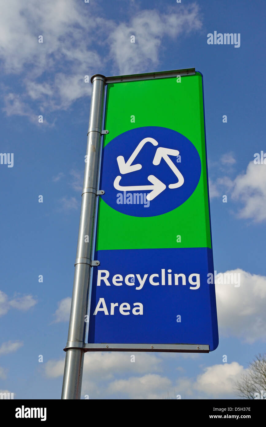 Recycling area sign outside Tesco Extra Supermarket, Addlestone, Surrey, England, United Kingdom Stock Photo