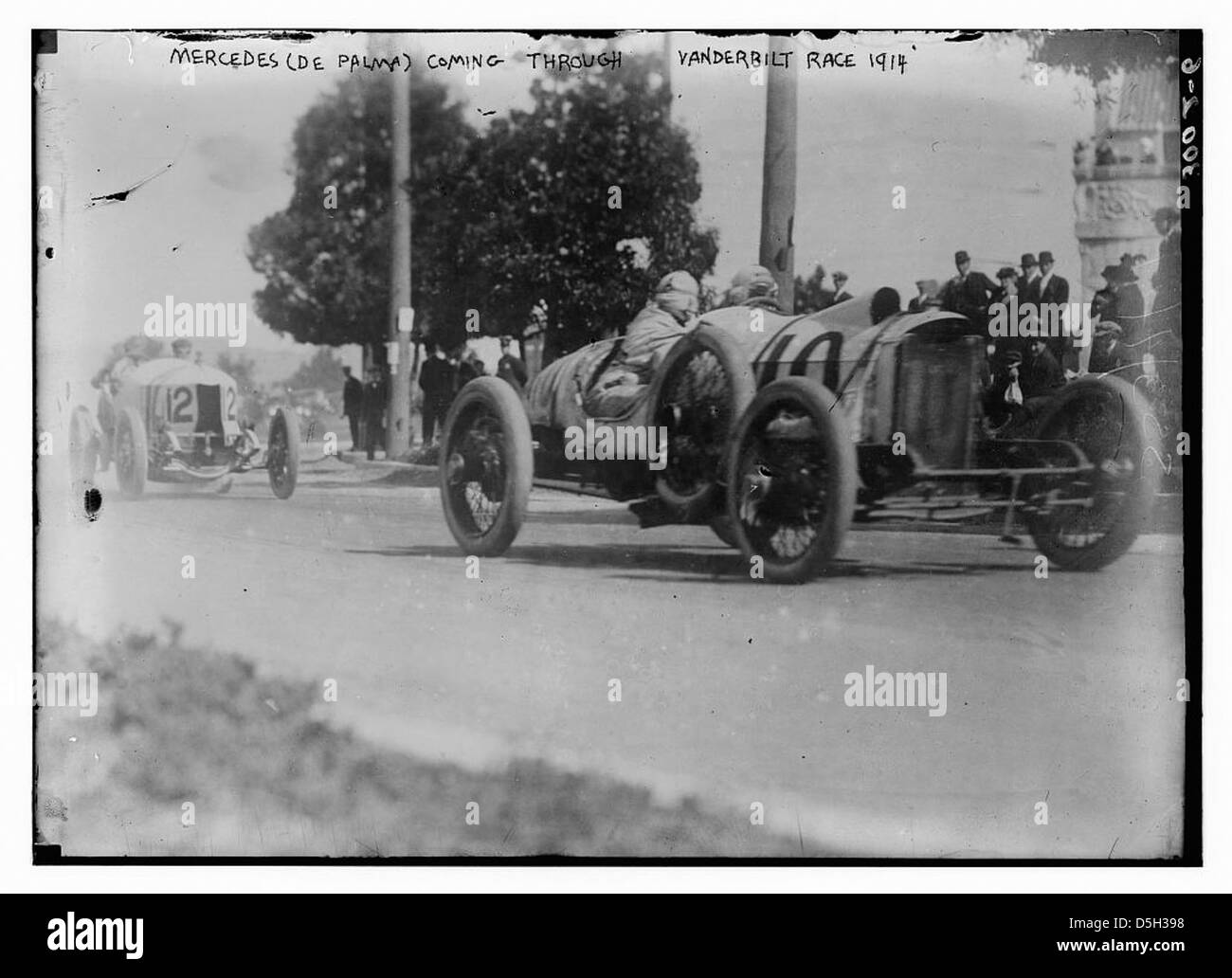 A 1914 image of the Mercedes, driven by Ralph De Palma, coming through the Vanderbilt Cup race in Santa Monica. The race was a prominent event in early auto racing history, highlighting the growing popularity of motorsports in the U.S. Stock Photo