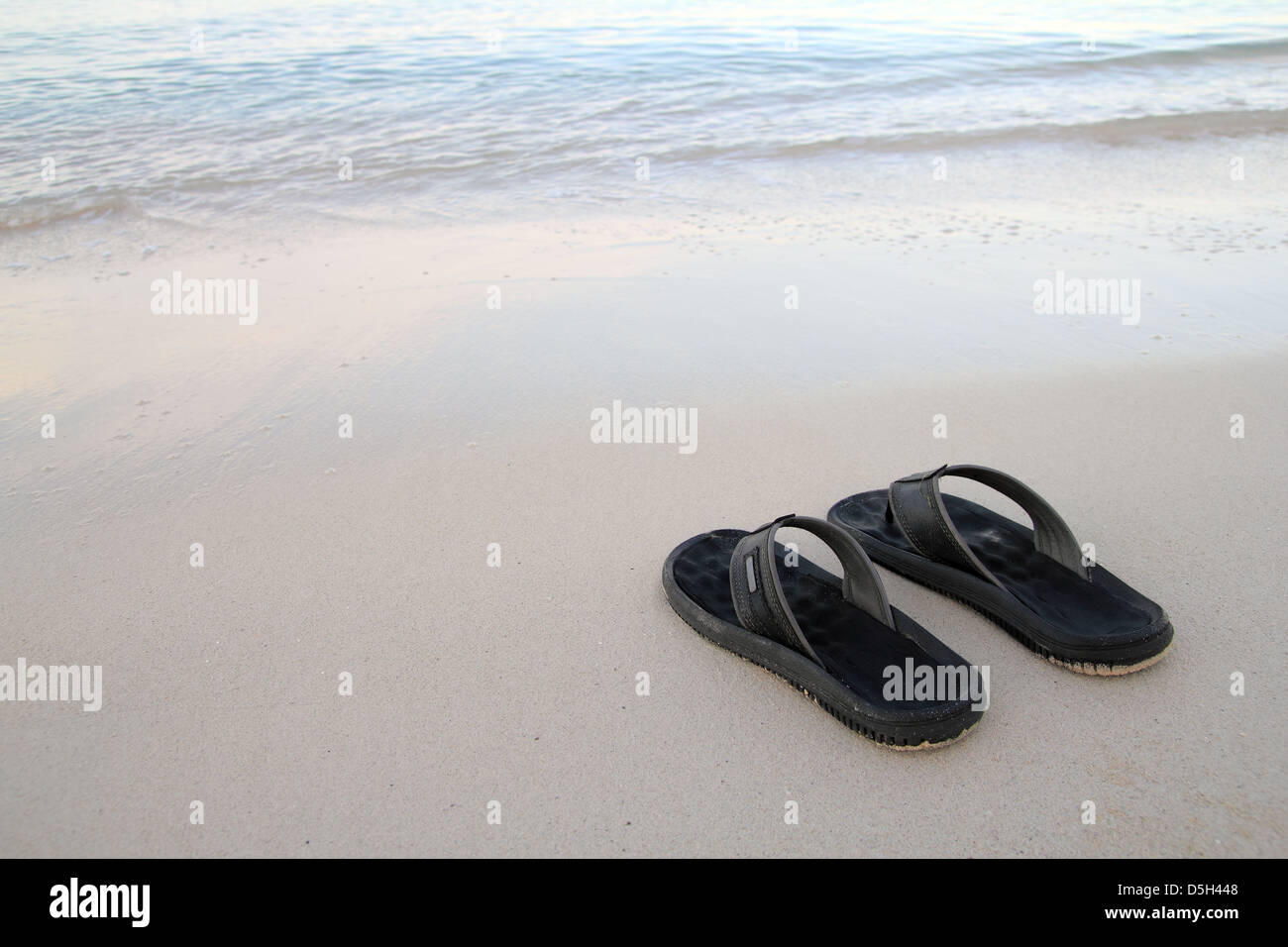 flip flops on the beach Stock Photo - Alamy