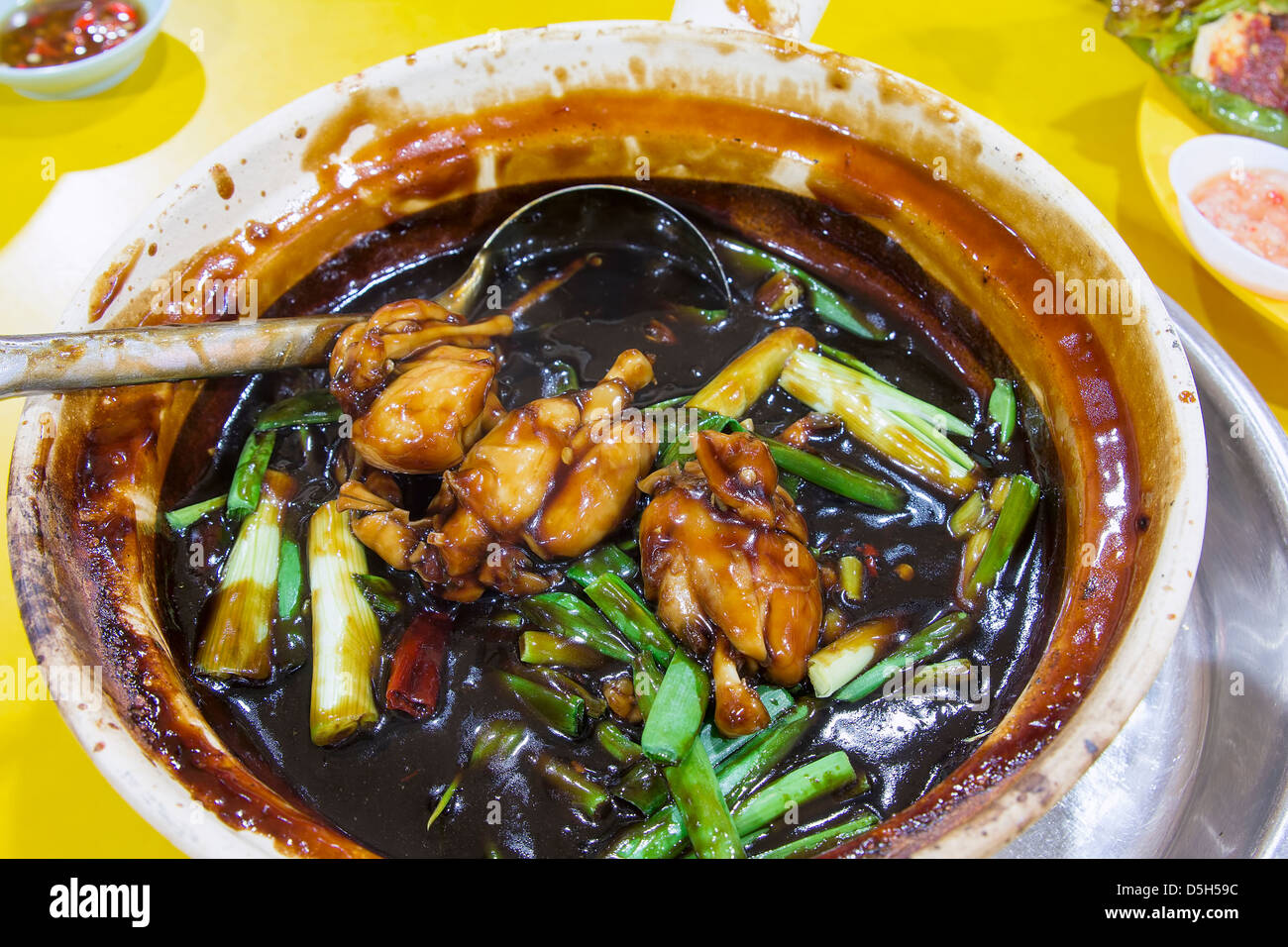 Claypot Frog Legs with Green Spring Onions in Brown Sauce Chinese Dish Stock Photo