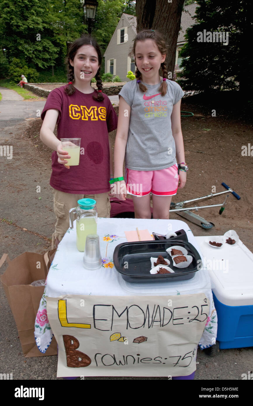 Two girls sell lemonaide on summer day outside of Concord, MA on Memorial Day, 2011 Stock Photo