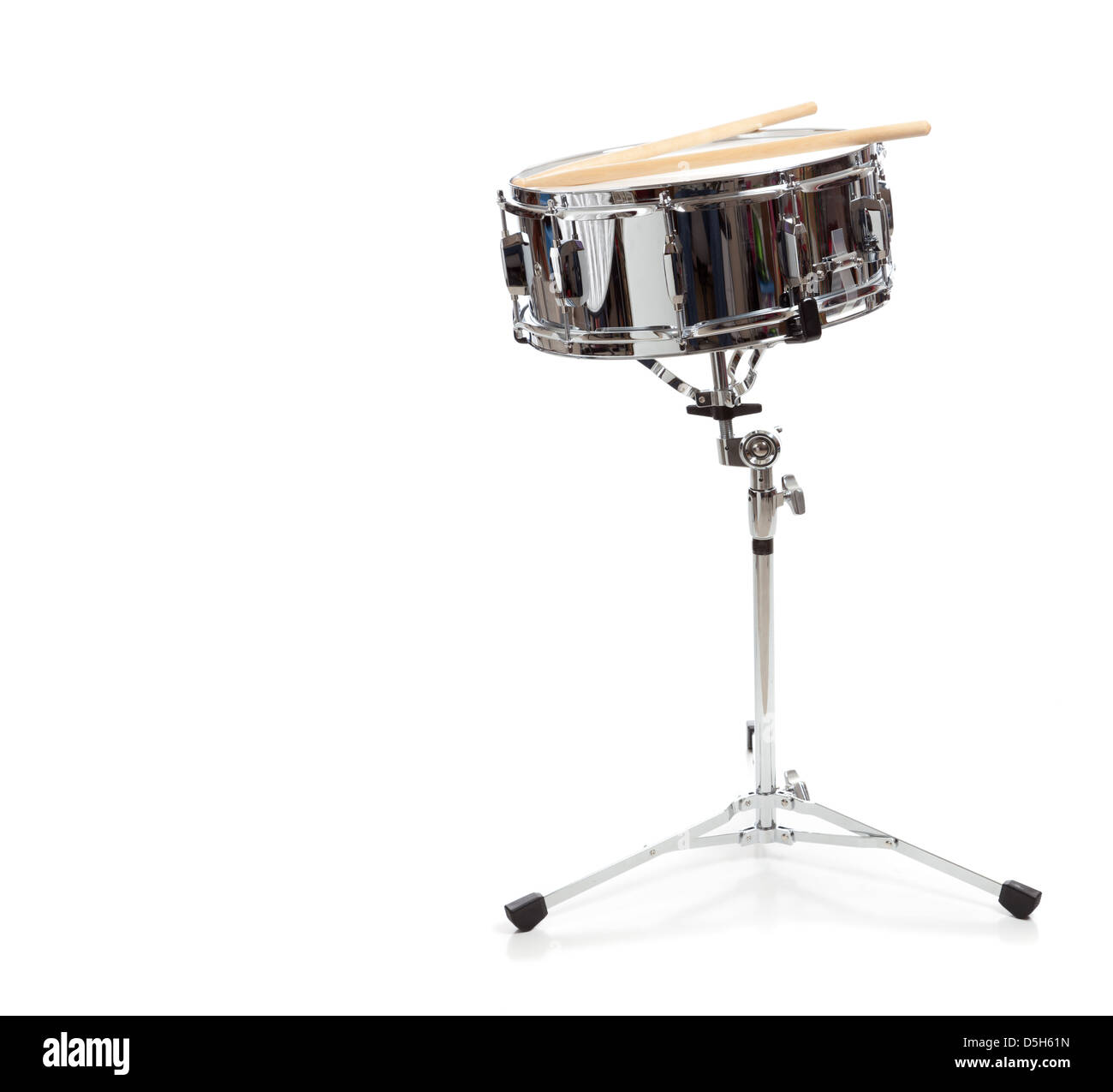 A snare drum with drumsticks on a white background Stock Photo Alamy