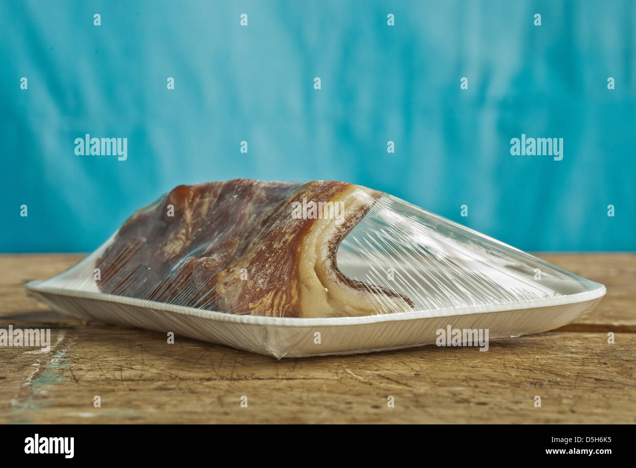 uncut bacon wrapped in plastic Stock Photo