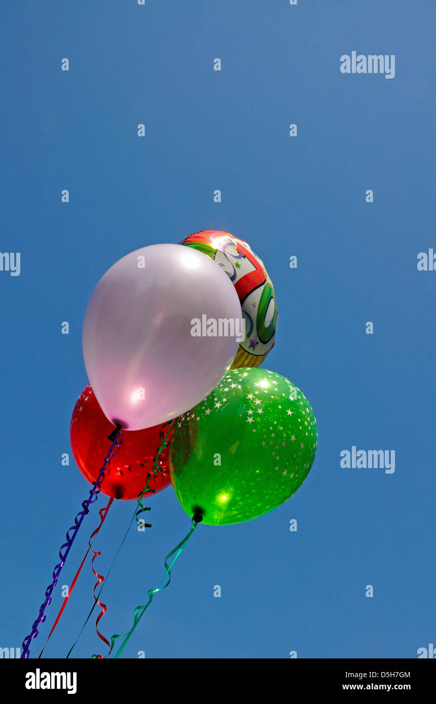 Bunch of balloons against a blue sky Stock Photo Alamy