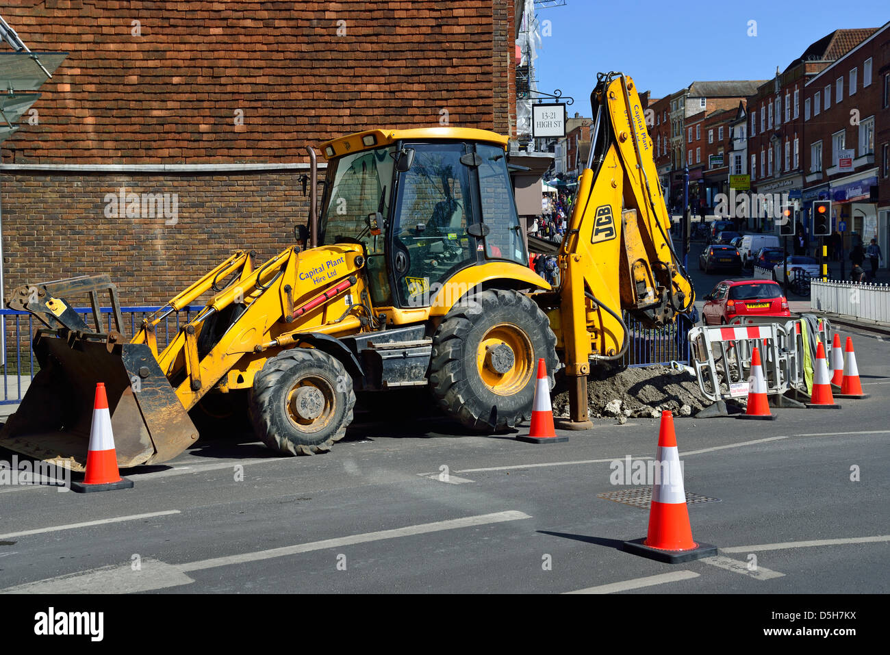 JCB digger and road works, Millbrook, Guildford, Surrey, England
