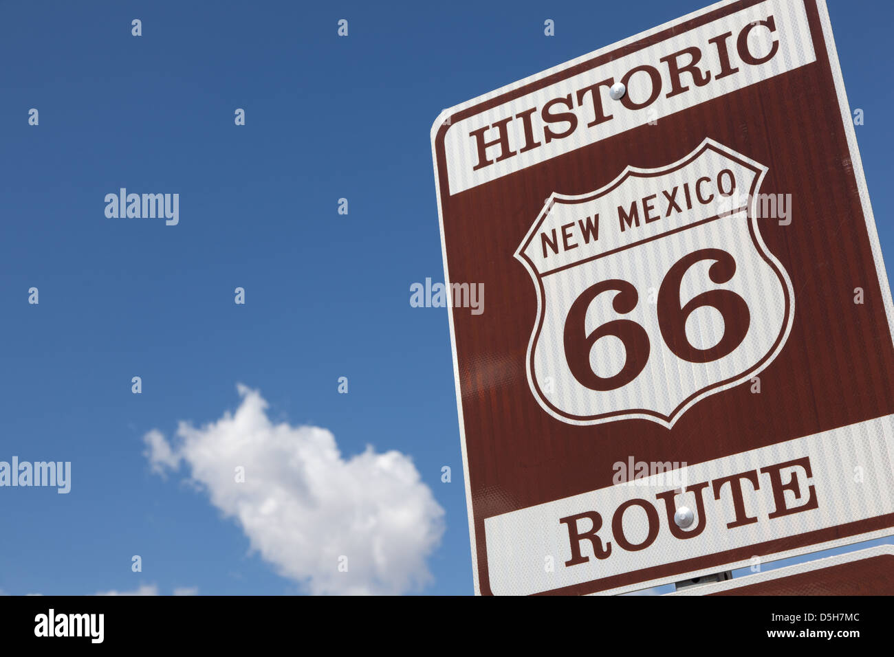 A Historic Route 66 road sign with a sky blue background Stock Photo