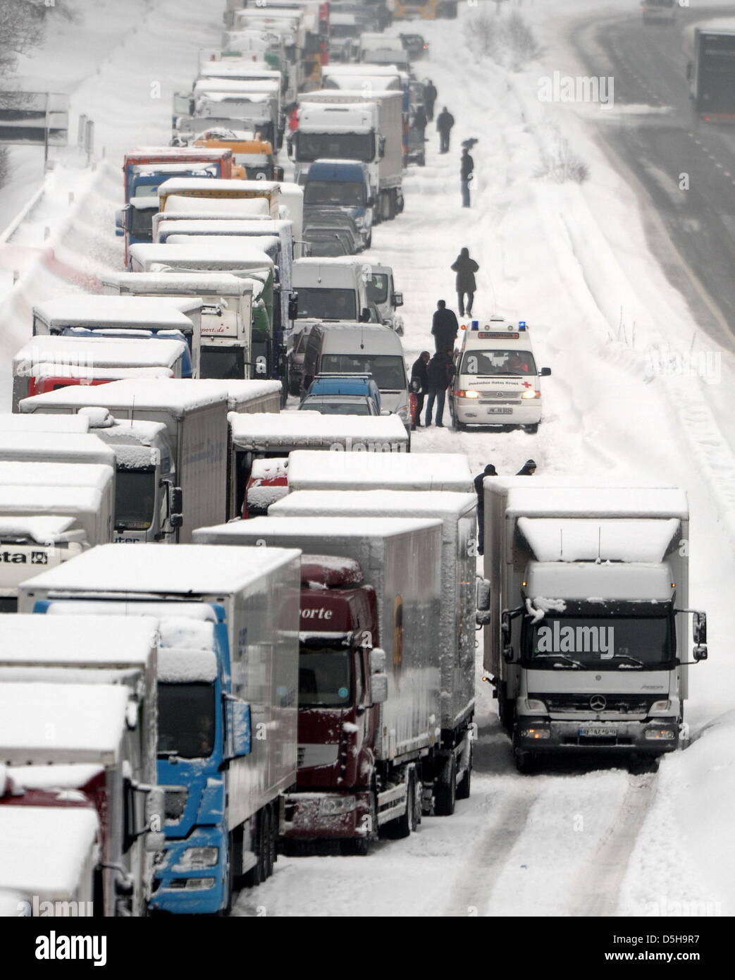Trucks and cars stands in a traffic jam on the A 45 motorway near ...