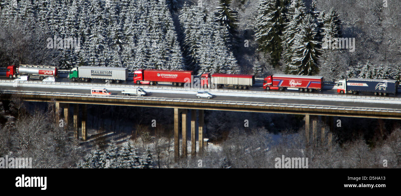 Aerial view of hundreds of lorries stuck in a traffic jam on motorway A45 near Siegen, Germany, 03 February 2010. Snow and ice have caused a 40km long traffic jam on the road crossing the mountainous 'Sauerland' region. Thousands of lorry and car drivers were forced to spend the last night in their cars, as numours vehicles were unable to carry on in uphill passages. The A45 is one Stock Photo