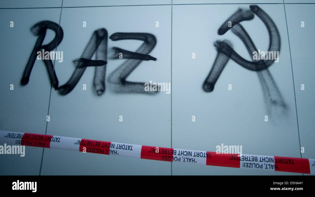 Raz Code Red Button The code 'RAZ' and hammer and sickle are sprayed onto a wall of the ...