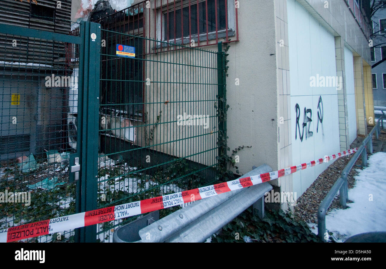 The police has roped off the 'House of Economy' with barrier tape, the code 'RAZ' and hammer and sickle are sprayed onto one of its walls in Berlin, Germany, 04 February 2010. As the police communicated, a gas cartridge had exploded at the back of the building in the night of 03 February and caused slight damage of soot. The offenders are supposedly left wing extremists; a Federal  Stock Photo