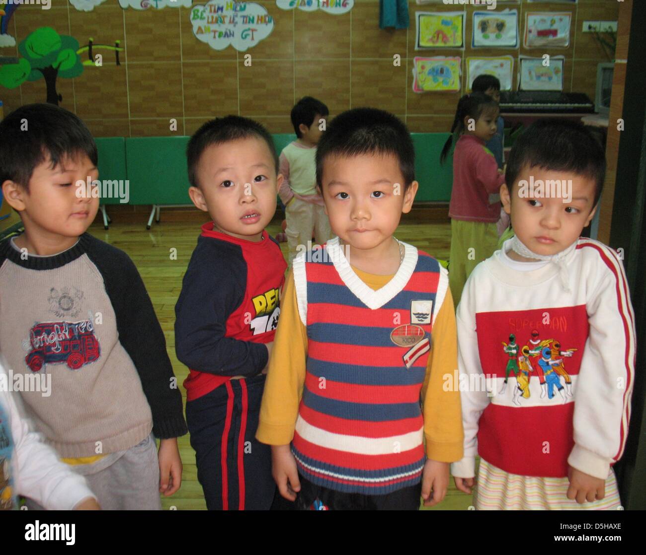 Fouryearold boys and girls on their way to gymnastics in a park in Hanoi, Vietnam, 07 December