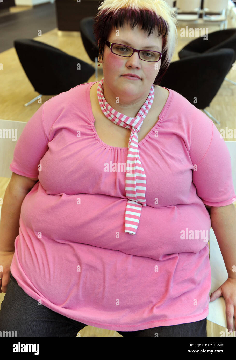 26-year-old woman Nicole sits on a chair previous to her examination of a nutrition consultation at the clinic for internal medicine of University Leipzig, Germany, dated 17 January 2010. The young woman, who weighed 230 kg before a gastric surgery, is happy about her now 162 kg and wants to achieve the weight of 80 kg. She belongs to a group of patients who suffer of adiposity (ob Stock Photo