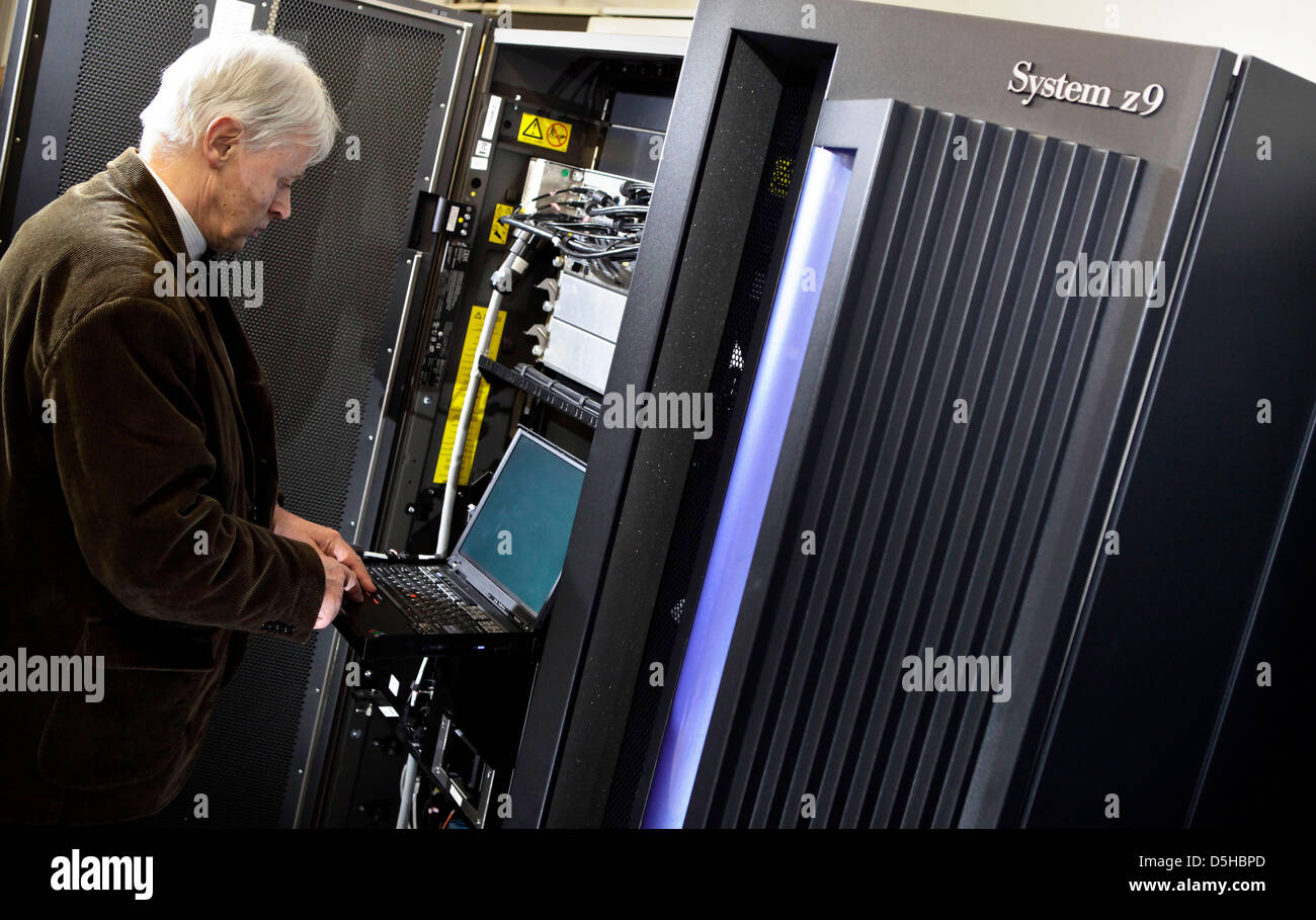 Head of the mainframne project Paul Hermann works at the IBM mainframe computer 'z9'at the university in Leipzig, Germany, 09 February 2010. 'z9' can reach 10,000 users at once. Although not state of the art anymore, banks and insurance companies still use mainframes for their computing processes. The university in Leipzig is the only university in Germany to educate students at a  Stock Photo