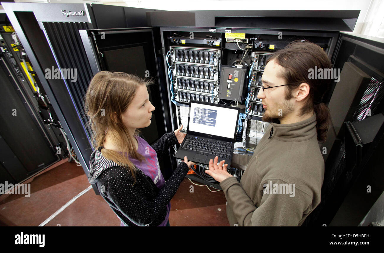 Computer science students Antonia Siegert and Markus Nentwig work at the IBM mainframe computer 'z9'at the university in Leipzig, Germany, 09 February 2010. 'z9' can reach 10,000 users at once. Although not state of the art anymore, banks and insurance companies still use mainframes for their computing processes. The university in Leipzig is the only university in Germany to educat Stock Photo
