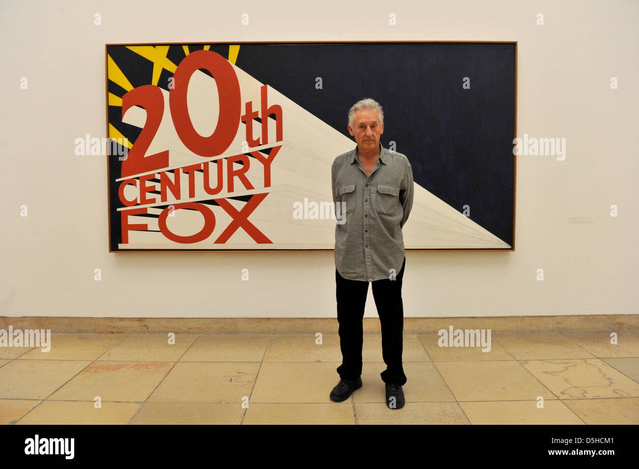 Artist Ed Ruscha poses in front of his painting 'Large Artist Ed Ruscha poses in front of his painting 'Large
