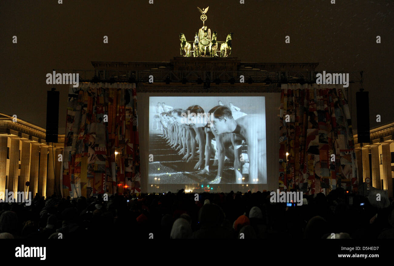On the occaision of the 60th Berlinale film festival, the silent film classic ''Metropolis'' is shown for the first time after 83 years in a almost full length version in front of Brandenburg Gate in Berlin, Germany, 12 February 2010. After the surprising find of an original version from the masterpiece by Fritz Lang in Argentina two years ago, the film was able to be restored in p Stock Photo