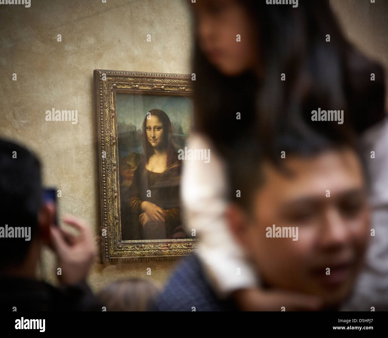 Mona Lisa by Leonardo da Vinci in the Louvre Paris with tourists Stock Photo