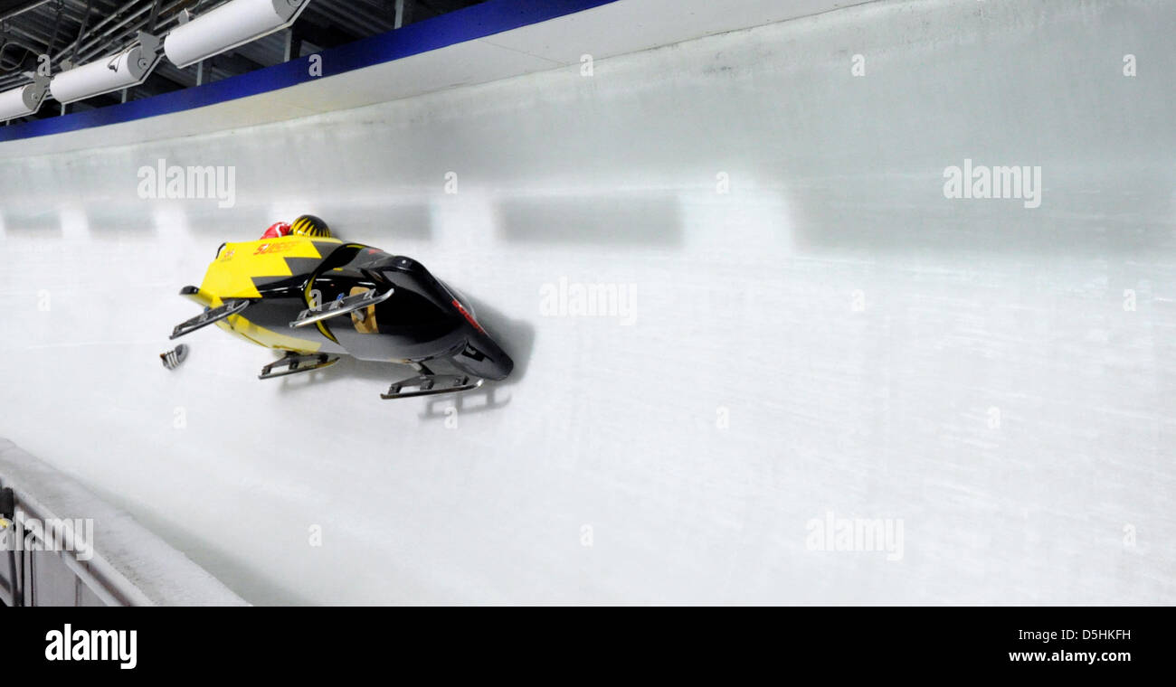 Bob of Swiss 1 with Beat Hefti crashes in a curve during Bobsleigh two-man training at the Whistler Sliding Center during the Vancouver 2010 Olympic Games in Whistler, Canada, 17 February 2010. Stock Photo