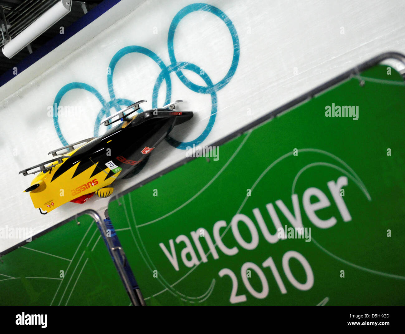 The Bob of Swiss 3 with Daniel Schmid crashes in a curve during Bobsleigh two-man training at the Whistler Sliding Center during the Vancouver 2010 Olympic Games in Whistler, Canada, 17 February 2010. Stock Photo