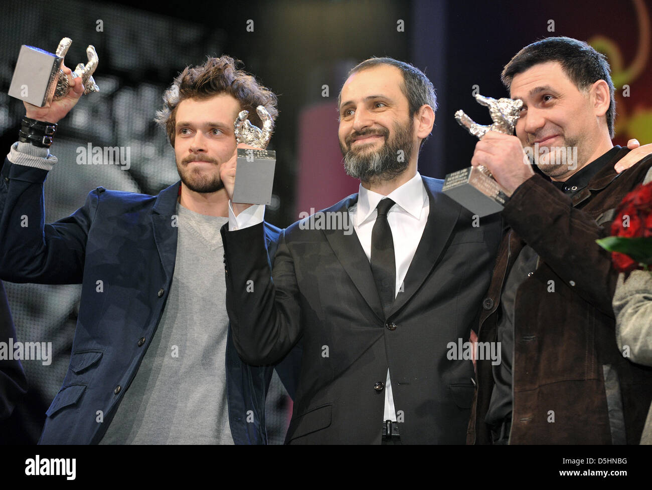 Russian actors Grigory Dobrygin (L) and Sergei Puskepalis (R) hold the Award for Best Actor (Silver Bear) for the movie 'How I Ended This Summer' while Russian director Alexei Popogrebsky holds the Silver Bear for Outstanding Artistic Achievement in the Category Camera for Pavel Kostomarov during the award ceremony of the 60th Berlinale International Film Festival in Berlin, German Stock Photo