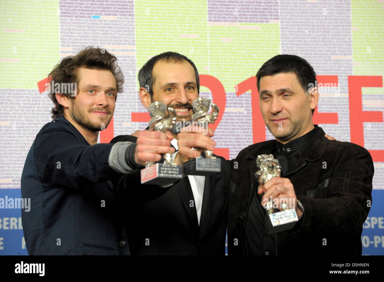 Russian actors Grigory Dobrygin (L) and Sergei Puskepalis (R) hold the Award for Best Actor (Silver Bear) for the movie 'How I Ended This Summer' while Russian director Alexei Popogrebsky holds the Silver Bear for Outstanding Artistic Achievement in the Category Camera on behalf of Pavel Kostomarov during the press conference after the closing ceremony of the 60th Berlinale Interna Stock Photo