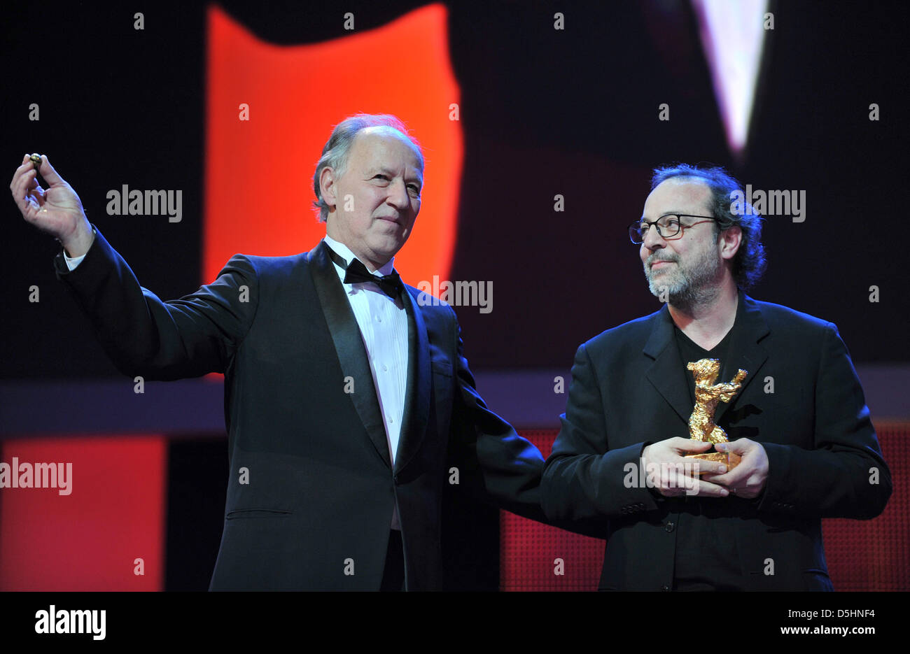 Director Semih Kaplanoglu (R) holds the Golden Bear for the Best Film for the movie 'Honey' next to jury president Werner Herzog during the award ceremony of the 60th Berlinale International Film Festival in Berlin, Germany, Saturday, 20 February 2010. Up to 400 films are shown every year as part of the Berlinale's public programme. The Berlinale is divided into different sections, Stock Photo