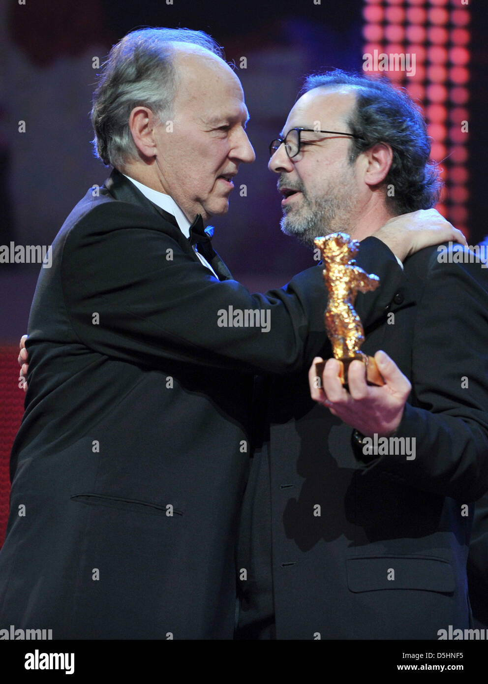 Jury president Werner Herzog (L) honors director Semih Kaplanoglu with the Golden Bear for the Best Film for the movie 'Honey' during the award ceremony of the 60th Berlinale International Film Festival in Berlin, Germany, Saturday, 20 February 2010. Up to 400 films are shown every year as part of the Berlinale's public programme. The Berlinale is divided into different sections, e Stock Photo